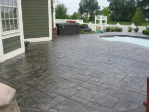 Stamped concrete patio idea in Apple Valley backyard with Large Ashlar Slate pattern